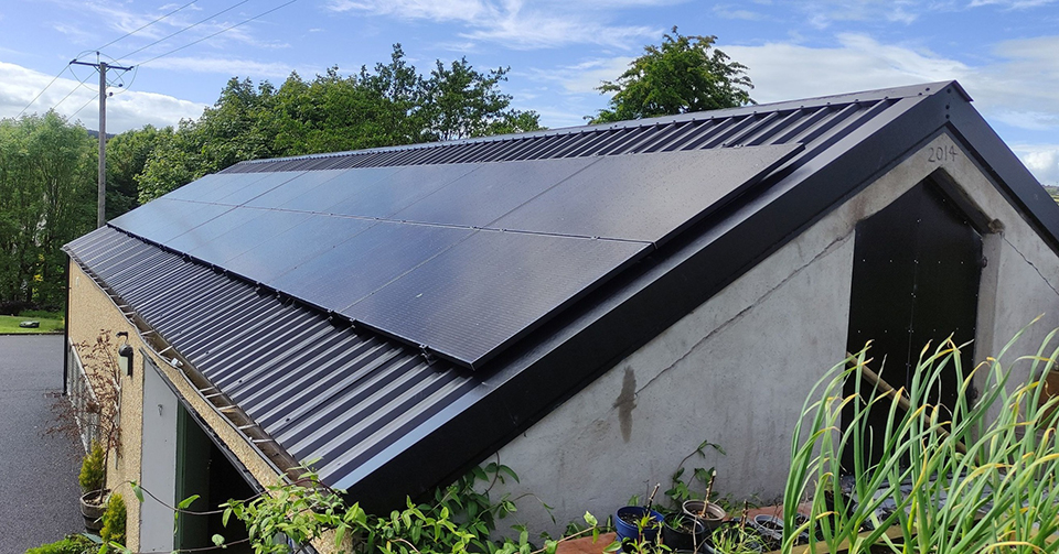 Solar panels mounted on the roof of a cottage